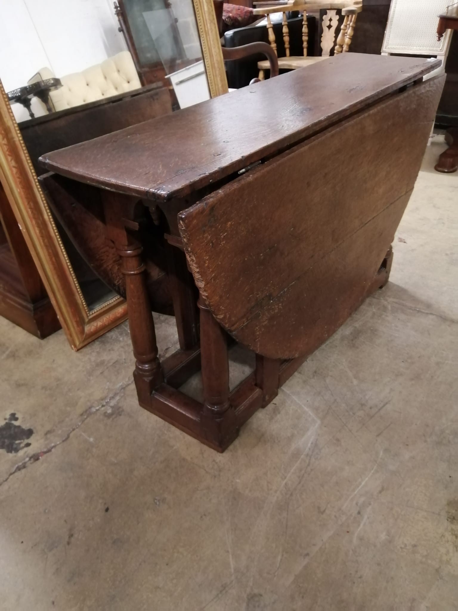 A 17th century oak gateleg table, (incorporates new timber to foot) length 152cm extended, width 120cm, height 72cm